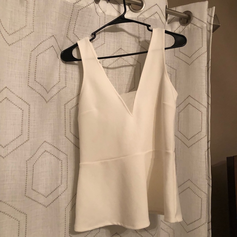 Cream peplum v neck top